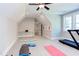 Spacious home gym including a treadmill, weight bench, workout mats, and a glass top desk at 298 Bonterra Way, Chapel Hill, NC 27516