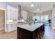 Gourmet kitchen featuring a large island with bar seating and modern appliances at 298 Bonterra Way, Chapel Hill, NC 27516