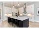 Modern kitchen featuring a large island, stainless steel appliances, and ample cabinet space at 298 Bonterra Way, Chapel Hill, NC 27516
