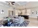 Open-concept living room adjacent to kitchen and featuring modern lighting fixtures at 298 Bonterra Way, Chapel Hill, NC 27516