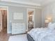 This main bedroom has hardwood floors and an open view into the bathroom at 298 Bonterra Way, Chapel Hill, NC 27516