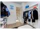 Organized walk-in closet with shelving and rods for clothing and shoe storage at 298 Bonterra Way, Chapel Hill, NC 27516