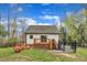 Beautiful backyard featuring a deck with stairs, outdoor seating, and a fenced area, perfect for outdoor enjoyment at 305 Dickens Rd, Fuquay Varina, NC 27526