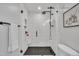 Bright bathroom featuring a glass-enclosed shower with rainfall showerhead and modern fixtures at 305 Dickens Rd, Fuquay Varina, NC 27526