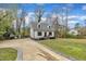 Attractive two-story home with a long driveway and lush green surroundings at 305 Dickens Rd, Fuquay Varina, NC 27526