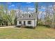 Inviting two-story home with a manicured lawn and iron decorative fence at 305 Dickens Rd, Fuquay Varina, NC 27526