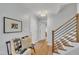 Inviting foyer with hardwood floors, bench seating, and staircase at 305 Dickens Rd, Fuquay Varina, NC 27526