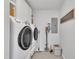 Well-equipped laundry room with modern appliances, ample storage, and organized accessories at 305 Dickens Rd, Fuquay Varina, NC 27526
