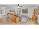 Cozy living room featuring a leather couch, area rug, and adjacent kitchen at 305 Dickens Rd, Fuquay Varina, NC 27526