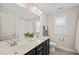 Bright bathroom with double sink vanity, large mirror, and a shower-tub combo at 309 Orange Blossom Ct, Wake Forest, NC 27587
