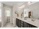 Bathroom with double sink vanity, soaking tub, and separate toilet room at 309 Orange Blossom Ct, Wake Forest, NC 27587