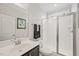 Modern bathroom featuring a glass-enclosed shower and a single sink vanity at 309 Orange Blossom Ct, Wake Forest, NC 27587
