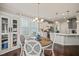Bright breakfast nook featuring a round table, stylish chairs, and natural light flowing into kitchen at 309 Orange Blossom Ct, Wake Forest, NC 27587