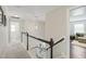 Upstairs hallway featuring carpeted floors and access to multiple rooms at 309 Orange Blossom Ct, Wake Forest, NC 27587