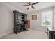Bright home office with a large desk, chair, and natural light at 309 Orange Blossom Ct, Wake Forest, NC 27587