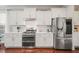 Modern kitchen featuring stainless steel appliances, white cabinets, and stylish countertops at 309 Orange Blossom Ct, Wake Forest, NC 27587
