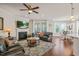 Cozy living room with a fireplace, comfortable seating, and abundant natural light at 309 Orange Blossom Ct, Wake Forest, NC 27587