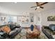 Comfortable living room with stylish decor, hardwood floors, and an open view into the kitchen at 309 Orange Blossom Ct, Wake Forest, NC 27587