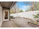 Backyard deck area featuring a wooden deck with built-in planters and a privacy fence at 321 E Lane St, Raleigh, NC 27601