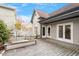 Backyard view of the home featuring a spacious wooden deck, beautiful landscaping, and access to the house at 321 E Lane St, Raleigh, NC 27601