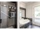Modern bathroom with shower and soaking tub at 321 E Lane St, Raleigh, NC 27601