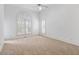 Spacious bedroom with large window and neutral carpet at 321 E Lane St, Raleigh, NC 27601