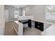 Bright bedroom featuring neutral walls, large windows, and built-in shelving and desk at 321 E Lane St, Raleigh, NC 27601