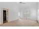 Sunlit bedroom featuring carpet, large arched window, and a view of a large bathroom at 321 E Lane St, Raleigh, NC 27601