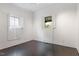 Bright bedroom with hardwood floors, white walls, natural light, and window shutters at 321 E Lane St, Raleigh, NC 27601