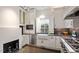 Stylish kitchen with stainless steel appliances, white cabinets, dark countertops at 321 E Lane St, Raleigh, NC 27601