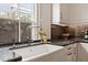 Bright kitchen featuring a white apron sink, modern faucet, and light cabinetry at 321 E Lane St, Raleigh, NC 27601