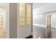 A hallway and doorway are viewed from a living room with built in display cabinet at 321 E Lane St, Raleigh, NC 27601