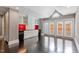 Elegant living area with French doors, high ceilings, and built-in bar with dark hardwood flooring at 321 E Lane St, Raleigh, NC 27601