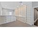 Spacious living room with custom built-in shelving, and a ceiling fan at 321 E Lane St, Raleigh, NC 27601