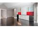 Open-concept living space with modern bar, storage, and seamless flow to other areas at 321 E Lane St, Raleigh, NC 27601