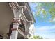 Low angle shot highlighting the decorative trim and structural elements of the porch at 321 E Lane St, Raleigh, NC 27601