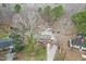 Aerial view of the property showing the house, driveway, mature trees, and surrounding landscape at 3617 Cranston Rd, Garner, NC 27529