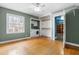 Spacious bedroom shows washer/dryer hookup, hardwood floors and natural light at 3617 Cranston Rd, Garner, NC 27529