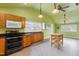 Functional kitchen featuring stainless steel appliances, abundant cabinet space, and natural light for cooking at 3617 Cranston Rd, Garner, NC 27529