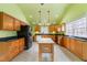 Well-equipped kitchen with modern appliances, wood cabinetry, and natural lighting, offering ample counter space at 3617 Cranston Rd, Garner, NC 27529