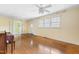 Bright living room with hardwood floors, natural light from the window, and an open doorway to another room at 3617 Cranston Rd, Garner, NC 27529