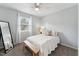 Bedroom featuring a bed with white bedding, accent bench, and a full size mirror at 402 Abbott Dr, Sanford, NC 27330