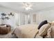 Bedroom showcasing neutral walls, white trim, and view to ensuite bathroom and walk-in closet at 402 Abbott Dr, Sanford, NC 27330