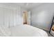 Bright bedroom with neutral colors, closet, ceiling fan and ensuite bathroom at 402 Abbott Dr, Sanford, NC 27330