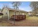 Cozy wooden deck attached to the home, ideal for outdoor relaxation and entertaining with a fenced yard at 402 Abbott Dr, Sanford, NC 27330