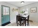 Inviting dining area with natural light, table with seating, and modern decor at 402 Abbott Dr, Sanford, NC 27330