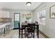 Bright dining area features tile floors, a breakfast table, and access to the kitchen at 402 Abbott Dr, Sanford, NC 27330