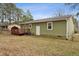Exterior view of the home featuring a wooden deck, showcasing its outdoor living space and architectural details at 402 Abbott Dr, Sanford, NC 27330