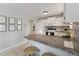 Bright kitchen features updated counter tops, appliances, and tiled flooring at 402 Abbott Dr, Sanford, NC 27330