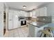 Eat-in kitchen features white appliances, granite countertops and an eat-in bar at 402 Abbott Dr, Sanford, NC 27330